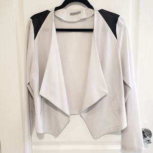 White blazer with black shoulder stripes